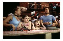 La familia en el parque de diversiones